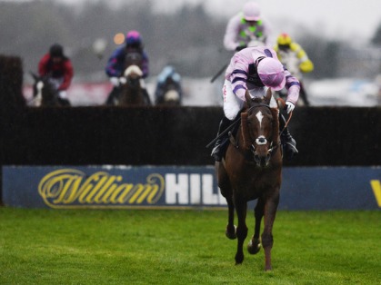 Noel Fehily steals a glance as Silviniaco Conti goes clear in the King George.